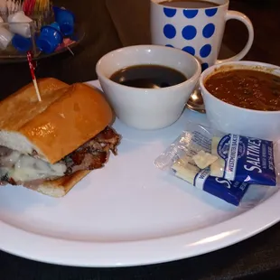 Half French dip sandwich in a side of chili