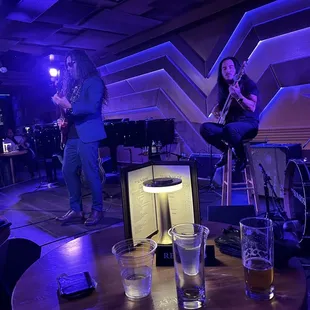 a band playing in a dimly lit room