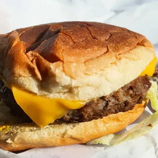 Old School Cheeseburger with lettuce, tomato, and onion, $3.75