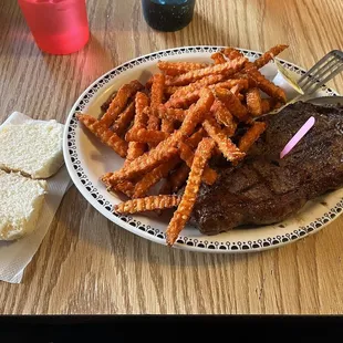 KC strip steak dinner with sweet potato fries and a roll (side salad also included)