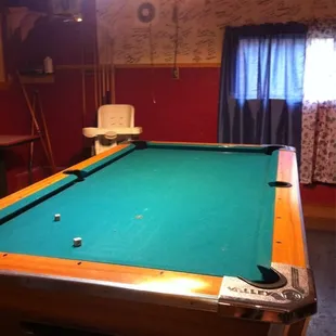 Pool table you will need quarters for and, oh hey, bring the kids they have a high chair.