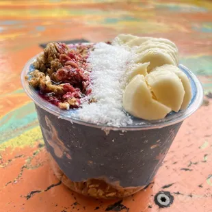 an ice cream sundae with fruit and nuts
