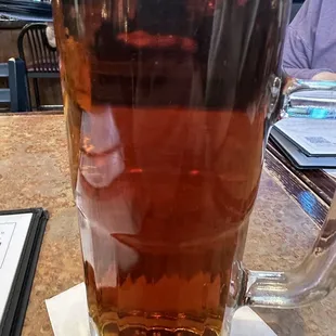a glass of beer on a table