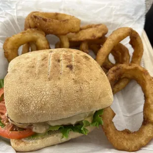 Uninspiring Tuna Melt with cardboard frozen Onion Rings at the Spreme Court Cafe.