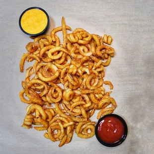 a pile of fries and ketchup