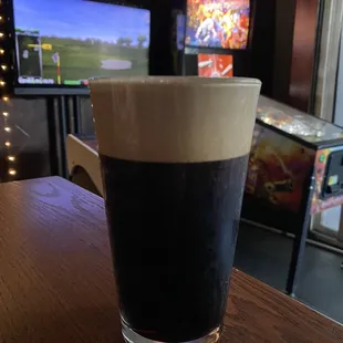 a pint of beer on a table