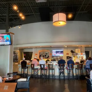 people sitting at the bar