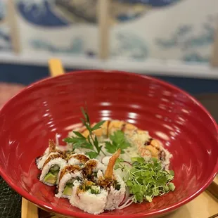 a red bowl of sushi