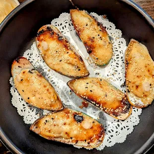 a skillet with chicken and rice