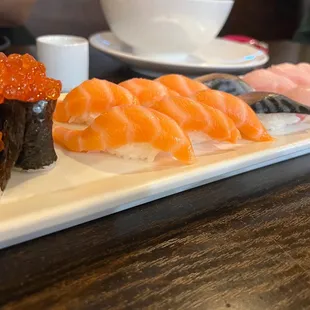 Salmon roe, salmon, mackerel, yellowtail sushi