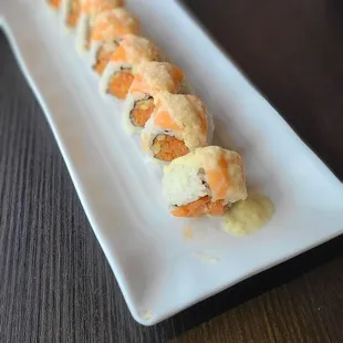 Smelly Yuzu Roll- Spicy Tuna, Topped with Salmon and Onion Yuzu Sauce