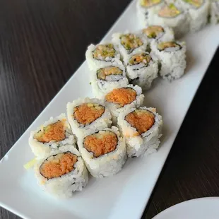 Spicy Tuna,  Yellowtail Scallion, and Blue Crab Cut Roll