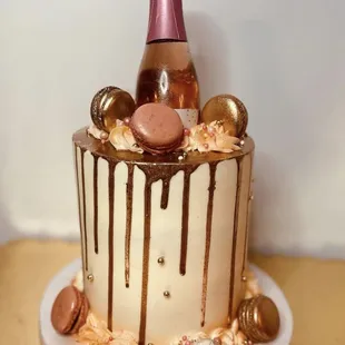 a cake with a bottle of champagne