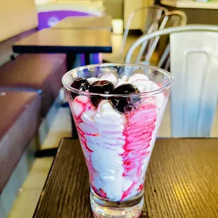 an ice cream sundae with cherries