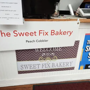 a sign for the sweet fix bakery