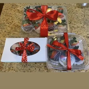 a box of chocolates with a red bow