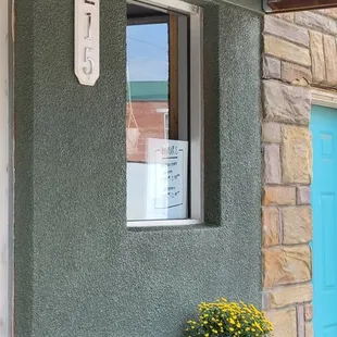 a table and chairs outside of a house