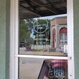the reflection of a chair in the window