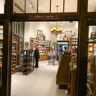 a storefront with shelves of goods