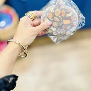 a woman holding a bag of candy