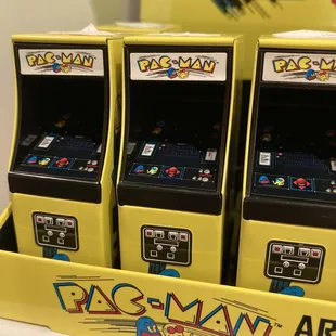 a row of pac - man arcade machines