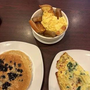 Breakfast: Blueberry pancakes, French toast bowl, and omelette. All shareable.