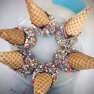 an ice cream cone with sprinkles