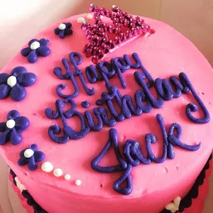 Small round princess birthday cake with pink &amp; purple sweetspot butter cream. This was a cake that they had in their case