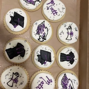 Personalized UW Whitewater graduation cookies. Snickerdoodle and scalloped edge sugar cookie with buttercream graduation decorations