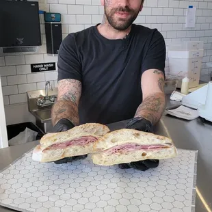 a man holding a sandwich