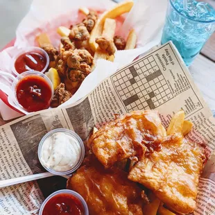  basket of fish and chips with sauces