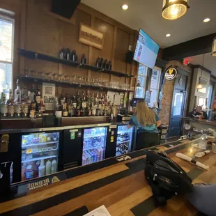 a bar with people sitting at it