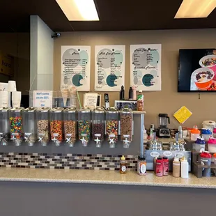 a counter with a variety of drinks