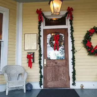 a front porch decorated for christmas