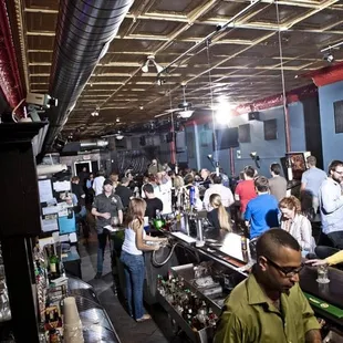 a crowd of people at a bar