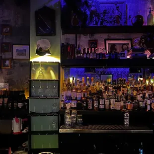 a bar filled with bottles of alcohol
