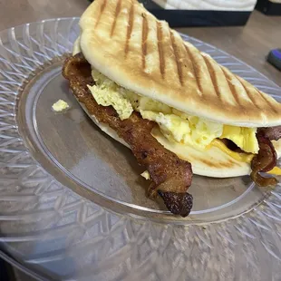 Bacon breakfast sandwich on flat bread. My friend got it on a croissant and it held together better but either way delicious!!