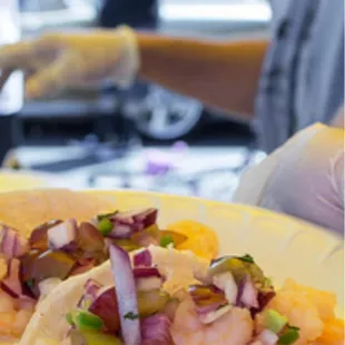 Butter poached shrimp taco with Chardonnay &amp; Cabernet grape pico de gallo.