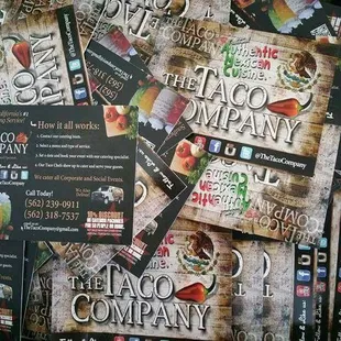 a pile of taco business cards