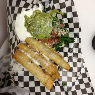 3 Taquito plate with side if freshly made guacamole and sour cream