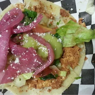 Veggie Taco! Grilled Cotija cheese on a corn tortilla, lettuce, Pico de gallo, guacamole jalapeño salsa and sweet purple onions