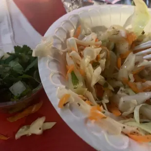 a plate of salad and a fork