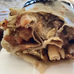 Breakfast sausage burrito with pico de gallo inside