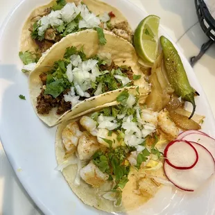 Top to Bottom: chicken taco, al pastor taco, and shrimp taco