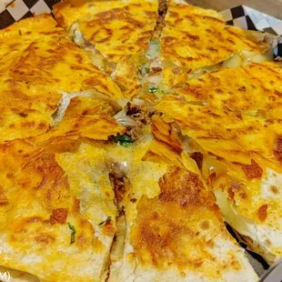 a cheesy pizza in a box