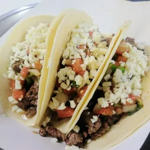 Carne Asada tacos! with hand diced pico de galla and queso fresco!