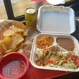 Delicious Chipotle shrimp taco's with some rice and beans. And side of Chips and salsa.