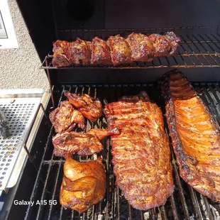 I know my Way around the Grill Son!!! . Beef Ribs at the top, two slabs of Baby Backs and Cornish hens . Good Stuff my People's...