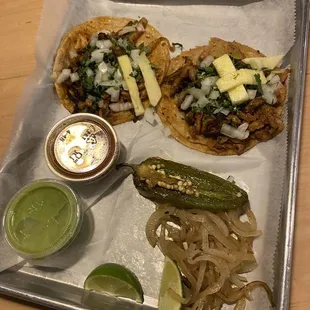 Delicious and affordable Al pastor tacos! Wish there was a bit more pineapple though!