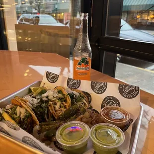 Chicken, steak, and carnitas tacos